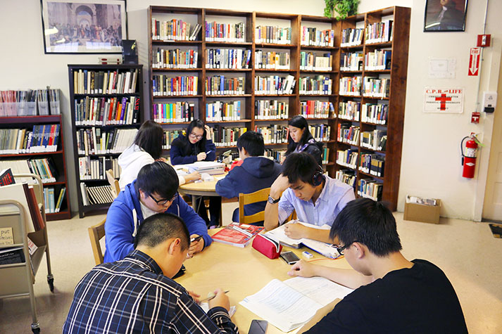 International students studying in library at boarding school, january activities calendar, boarding school
