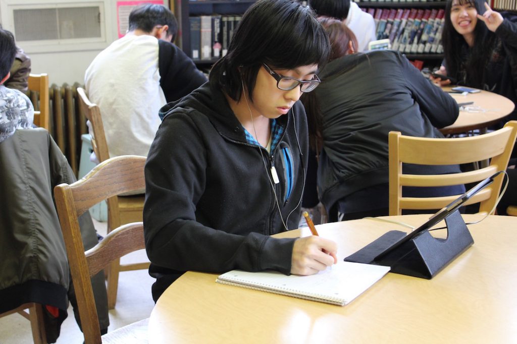 christian high school student, studying in the library, at Canyonville Christian Academy