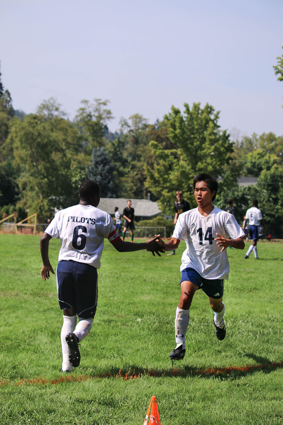 Top Christian Academy's Boys Soccer team, encourage each other during game,