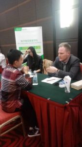 Interested student, in China, talking to Gene Kovalov from Canyonville Academy