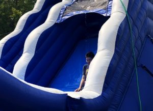 Huge blue water slide, at Canyonville Academy, a college preparatory, high school, fun day event