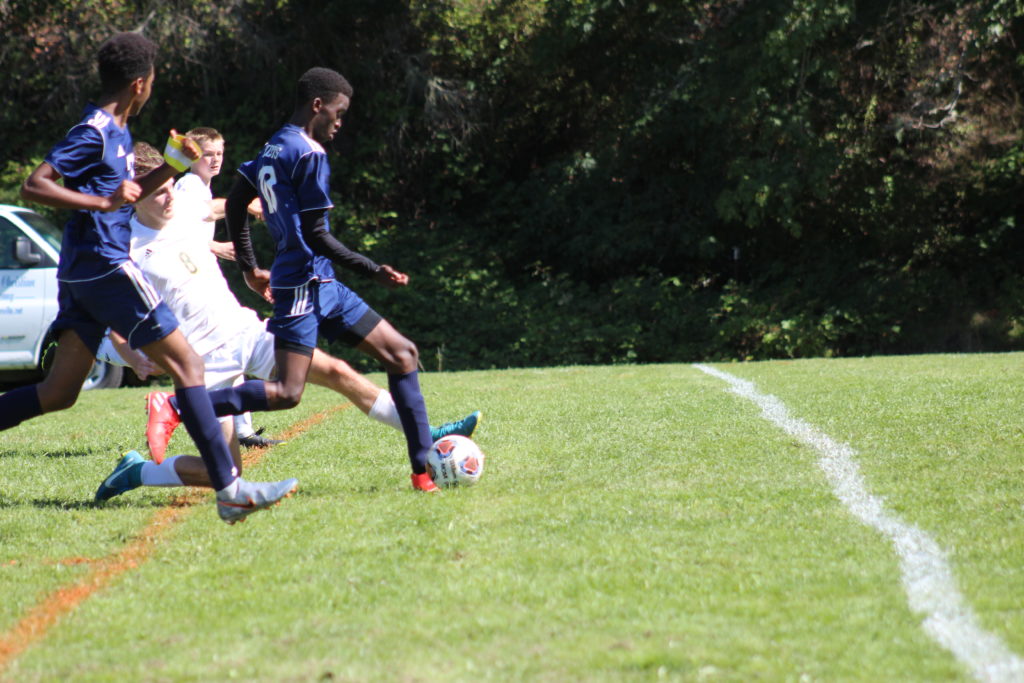 The Boys Soccer Team plays a match vs their opponent.