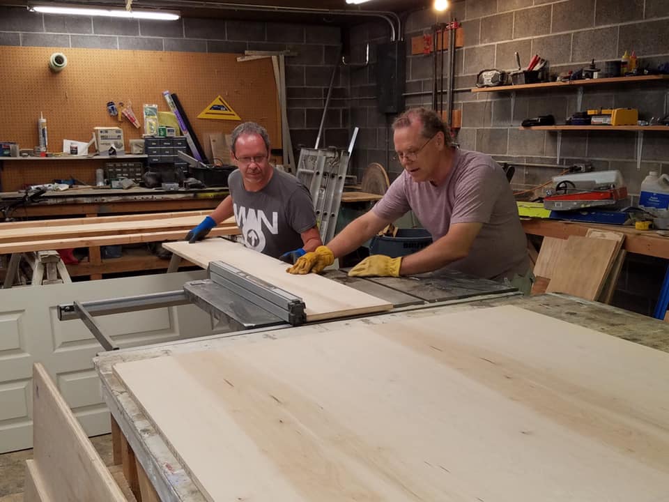 Volunteers working in the wood shed.