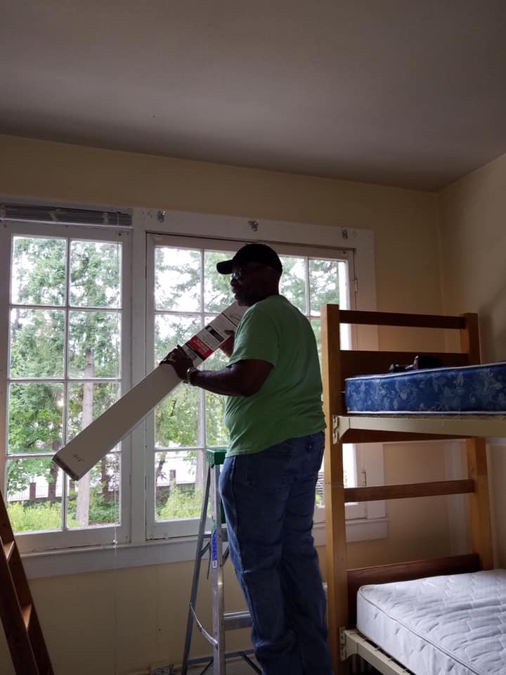 Summer volunteers prepare the dorms for the next school year.